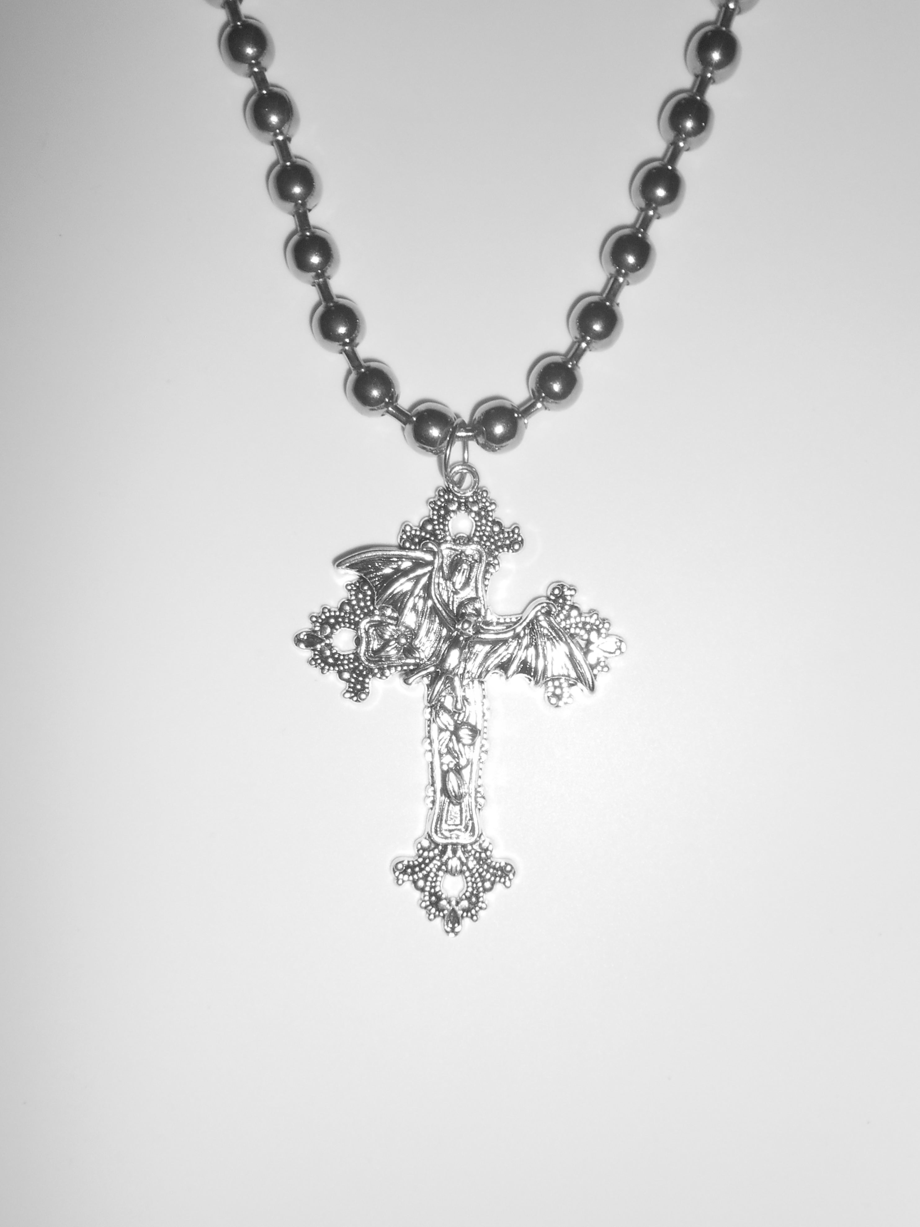 Collar de alas cruzadas